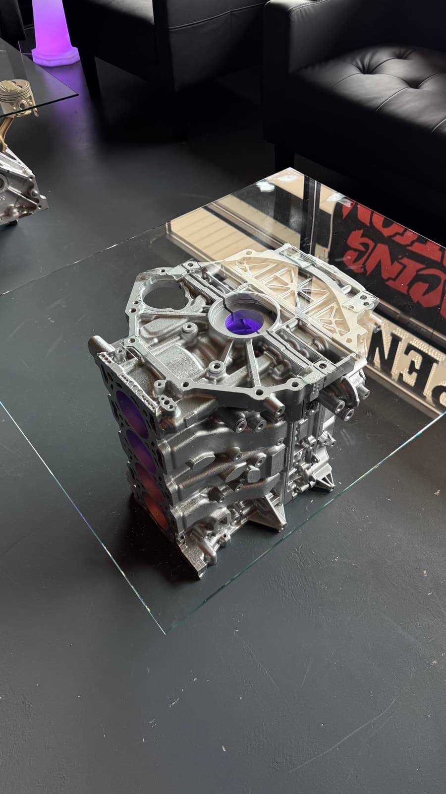 Engine block displayed on a glass table